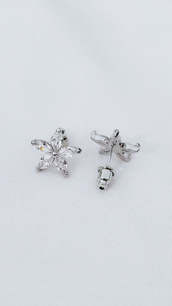 Sparkly flower stud earrings with marquise-cut cubic zirconia in silver. Lightweight, everyday shine, gift-ready.