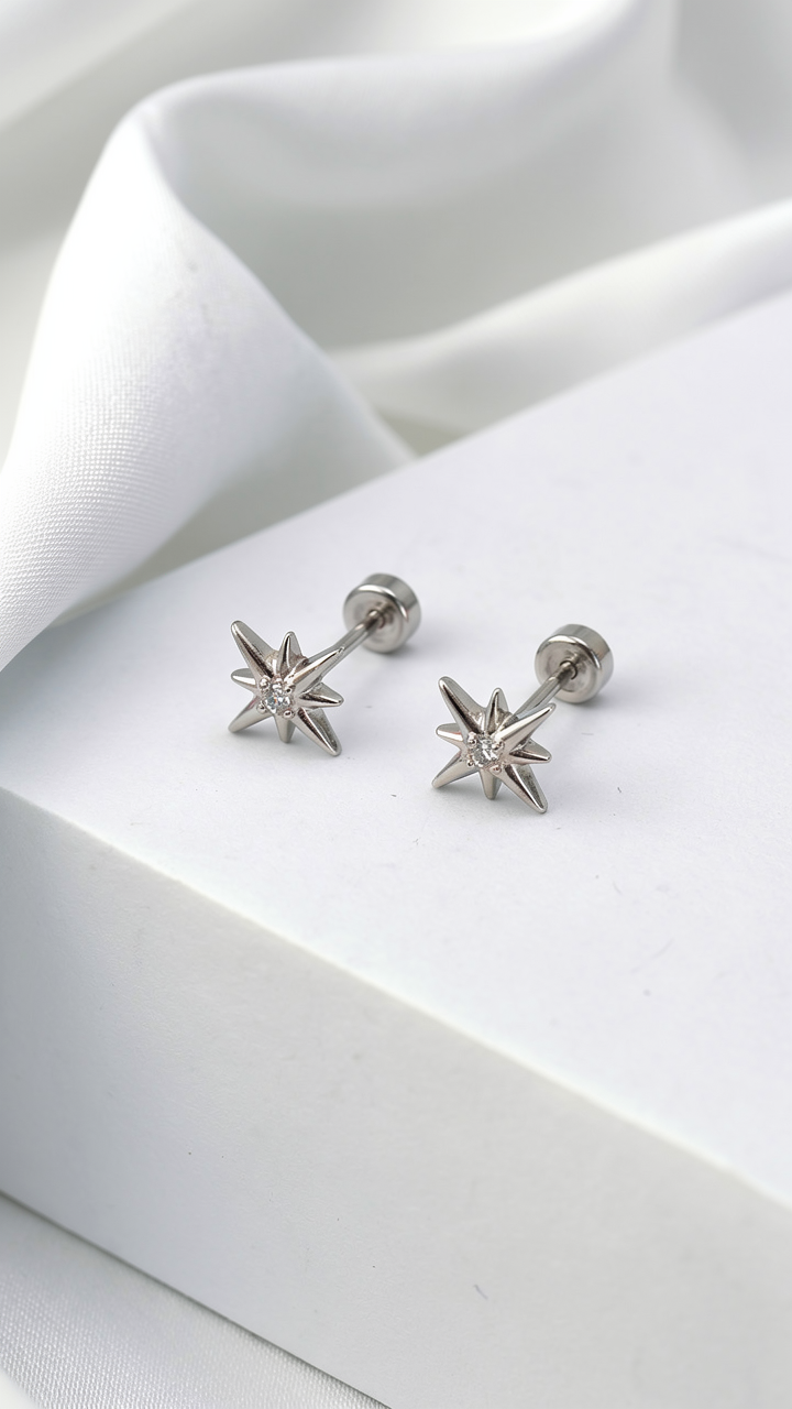 Minimal north star stud earrings in silver with cubic zirconia. Celestial everyday earrings.